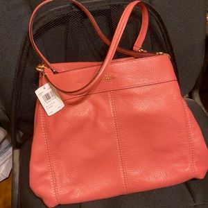 Coach Lexi pink satchel with  tags attached.